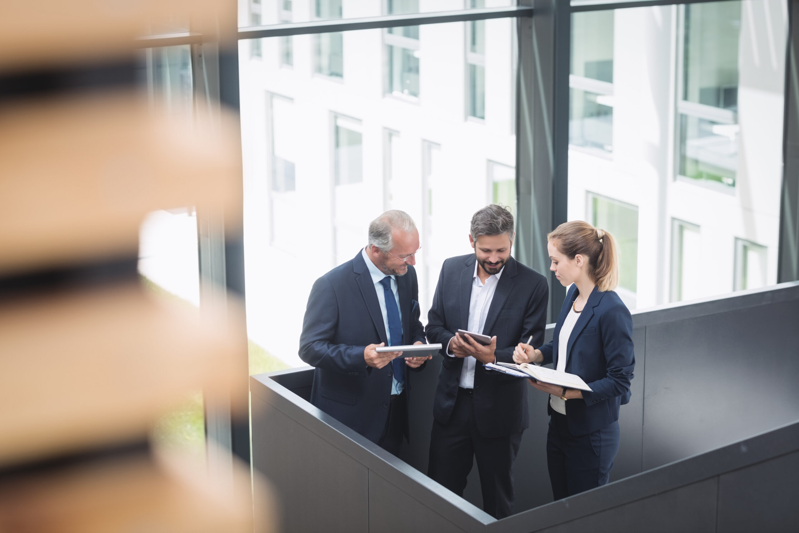 businesspeople-having-discussion-office-scaled.jpg